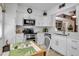 Bright kitchen featuring white cabinets, stainless appliances, and open layout at 318 108Th St W # 318, Bradenton, FL 34209