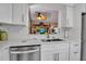 Renovated kitchen showcasing stainless steel appliances and white cabinets at 318 108Th St W # 318, Bradenton, FL 34209