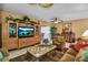 Bright living room with beautiful built-ins and a cozy seating area at 318 108Th St W # 318, Bradenton, FL 34209