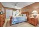 Spacious main bedroom featuring a sliding barn door to ensuite bathroom and plenty of closet space at 318 108Th St W # 318, Bradenton, FL 34209