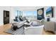 Comfortable living room with water views, fireplace, and stylish furnishings at 340 Gulf Of Mexico Dr # 115, Longboat Key, FL 34228