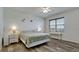 A comfortably sized bedroom with wood flooring and an abundance of natural light at 3478 Parkridge Cir # 32-104, Sarasota, FL 34243