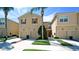 Charming townhome with a well-manicured lawn, attached garages, and lush landscaping at 3478 Parkridge Cir # 32-104, Sarasota, FL 34243
