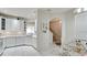 A kitchen with white cabinets, tile floors, and an adjoining dining area at 3478 Parkridge Cir # 32-104, Sarasota, FL 34243