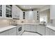 Bright kitchen featuring white cabinetry, modern appliances, and plenty of counter space at 3478 Parkridge Cir # 32-104, Sarasota, FL 34243