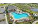 Aerial shot of community pool and recreation area with ample seating, landscaping, and shaded pavilion at 427 157Th E Ct, Bradenton, FL 34212