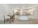 Modern kitchen featuring white cabinets, granite countertops, and a central island at 427 157Th E Ct, Bradenton, FL 34212
