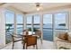 Bright dining area with water views, tile floors, and wicker chairs for a cozy atmosphere at 4310 Falmouth Dr # 304, Longboat Key, FL 34228