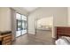 Bedroom featuring a sliding glass door to the outside patio and view of the living room at 4423 Park Lake N Ter, Bradenton, FL 34209