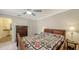 Comfortable bedroom featuring a full bed with quilt, tile floors and a ceiling fan at 4423 Park Lake N Ter, Bradenton, FL 34209