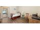 Bedroom featuring a trundle bed, side table, desk and wood flooring at 4423 Park Lake N Ter, Bradenton, FL 34209