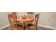 Classic dining room features a round wooden table with intricately designed wooden chairs at 4423 Park Lake N Ter, Bradenton, FL 34209