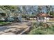 Landscaped entry to the community with guard house, mature trees, and a secure gate at 4423 Park Lake N Ter, Bradenton, FL 34209