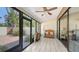 Bright Florida room with tile floors, large windows, and access to the outdoor patio at 4423 Park Lake N Ter, Bradenton, FL 34209