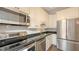 This bright kitchen features stainless steel appliances and ample cabinet space at 4423 Park Lake N Ter, Bradenton, FL 34209