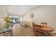 Sun-filled living room boasts high ceilings, wood floors, and a sliding glass door to a screened porch at 4423 Park Lake N Ter, Bradenton, FL 34209