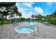 Community pool and spa area, surrounded by lounge chairs and lush landscaping at 4423 Park Lake N Ter, Bradenton, FL 34209