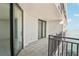Relaxing balcony with black railings overlooking the serene waterfront view at 4822 Ocean Blvd # 11E, Sarasota, FL 34242