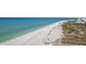 Beautiful view of Siesta Key Beach, known for its soft, white sand and clear turquoise waters, perfect for relaxation and recreation at 4822 Ocean Blvd # 11E, Sarasota, FL 34242