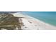 Aerial view of Siesta Key Beach with sandy white beaches, gulf waters, and sunny skies, making for a picturesque coastal scene at 4822 Ocean Blvd # 11E, Sarasota, FL 34242