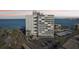 A multi-story building featuring convenient covered parking and stunning beach access at 4822 Ocean Blvd # 11E, Sarasota, FL 34242