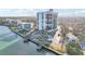 Modern condo with a private pool and canal access, with vibrant sky at sunset at 4822 Ocean Blvd # 11E, Sarasota, FL 34242