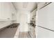 Efficient kitchen with white appliances and ample cabinet storage at 4822 Ocean Blvd # 11E, Sarasota, FL 34242