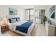 Inviting main bedroom with balcony access and a serene, coordinated design at 4822 Ocean Blvd # 11E, Sarasota, FL 34242