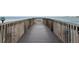 Wooden boardwalk extending out over the water to a seating area offering stunning views of the Gulf at 4822 Ocean Blvd # 11E, Sarasota, FL 34242