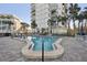 Modern pool area featuring a uniquely shaped pool and ample seating at 4822 Ocean Blvd # 11E, Sarasota, FL 34242