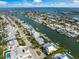 An aerial view of waterfront homes showcasing a network of canals and access to the open bay at 511 68Th St, Holmes Beach, FL 34217