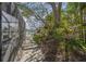 A lush backyard with a stone pathway and views of the waterfront at 511 68Th St, Holmes Beach, FL 34217