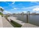 This waterfront home features a private dock, ideal for boating and enjoying waterfront living at 511 68Th St, Holmes Beach, FL 34217