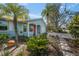 Inviting exterior featuring lush tropical plants and stylish walkway leading to the front entrance at 511 68Th St, Holmes Beach, FL 34217