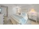 Serene main bedroom with a comfortable bed, stylish decor, and ample closet space at 511 68Th St, Holmes Beach, FL 34217