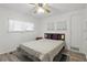 This bedroom features neutral paint, wood-look floors, and bright, natural light at 5235 Cherry Hill Ave, Sarasota, FL 34234
