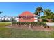 Sign for Tri-Par Estates, a deed-restricted 55 and older community with lush landscaping at 5235 Cherry Hill Ave, Sarasota, FL 34234