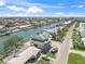 Aerial view of waterfront property with canal access and neighborhood street in waterfront community at 525 68Th St St, Holmes Beach, FL 34217