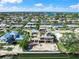 Aerial view of waterfront property with canal access and neighborhood street in waterfront community at 525 68Th St St, Holmes Beach, FL 34217