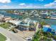 Aerial view of home under construction in waterfront neighborhood with canal access and coastal views at 525 68Th St St, Holmes Beach, FL 34217