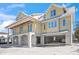 New construction home showing the open garages underneath the main floor at 525 68Th St St, Holmes Beach, FL 34217