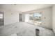 Living room showcasing the waterfront view through the sliding glass doors at 525 68Th St St, Holmes Beach, FL 34217