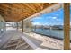 Covered outdoor patio overlooking scenic waterfront and boat docks at 525 68Th St St, Holmes Beach, FL 34217
