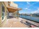 Outdoor patio with direct access to canal and scenic waterfront views at 525 68Th St St, Holmes Beach, FL 34217