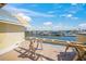 Waterfront home under construction featuring beautiful canal views and a sunny sky at 525 68Th St St, Holmes Beach, FL 34217