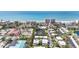 Real estate aerial view of houses, water feature, ocean, and buildings at 534 Sutton Pl, Longboat Key, FL 34228