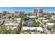 Real estate aerial view of houses, water feature, ocean, and buildings at 534 Sutton Pl, Longboat Key, FL 34228