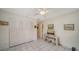 Charming bedroom featuring tile flooring, closet doors, and cozy decor at 534 Sutton Pl, Longboat Key, FL 34228