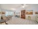 Bright dining room with tile flooring, ceiling fan, and multiple seating areas at 534 Sutton Pl, Longboat Key, FL 34228