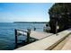 Community dock with boat lift offers convenient access to the open water and stunning views at 534 Sutton Pl, Longboat Key, FL 34228